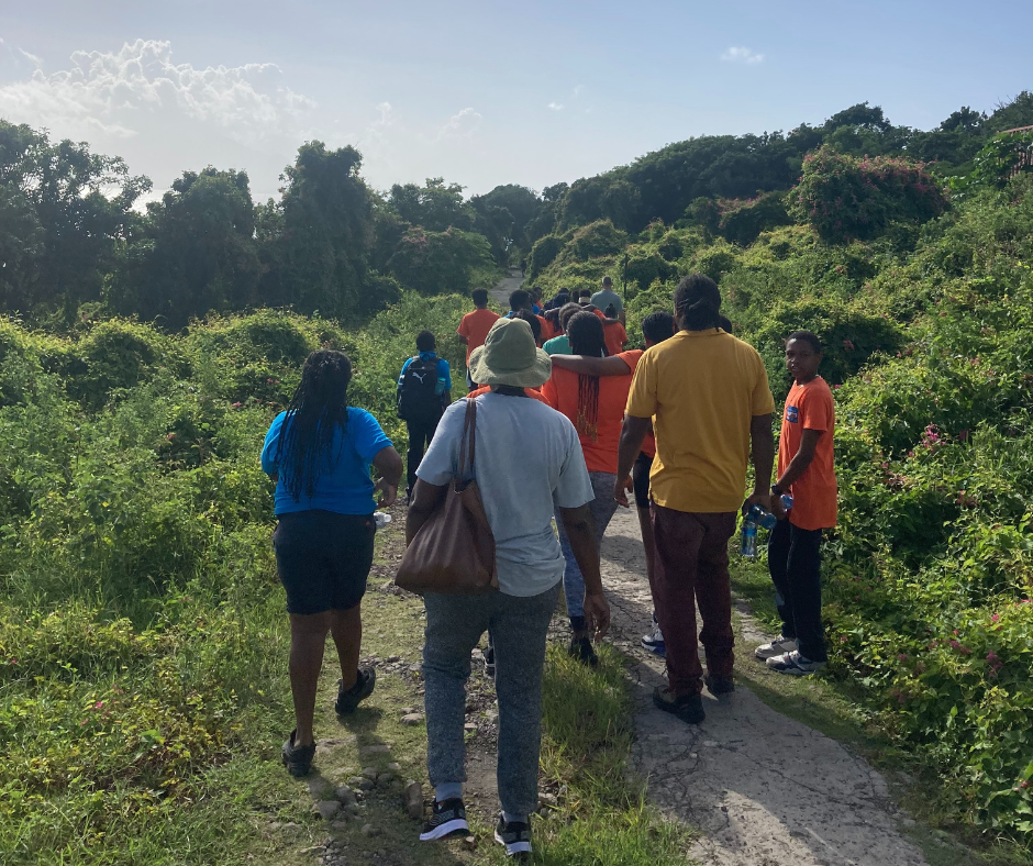 The group embarks on a hike to look for land crab habitats